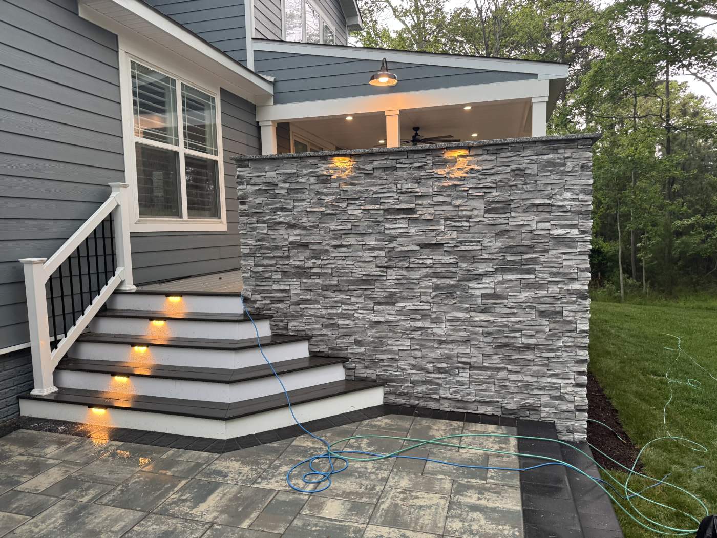 rehoboth-beach-custom-porch-delmarva.jpg Custom porch with a veneer wall and landscaping lights in rehoboth Beach